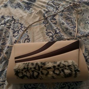 Women’s tan cheetah print purse